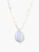 Teardrop blue lace agate pendant with silver frame. Beaded necklace includes white pearls and light blue beads.
