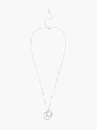 Silver necklace with two interlocking loops; one loop is organically shaped, the other is round.
