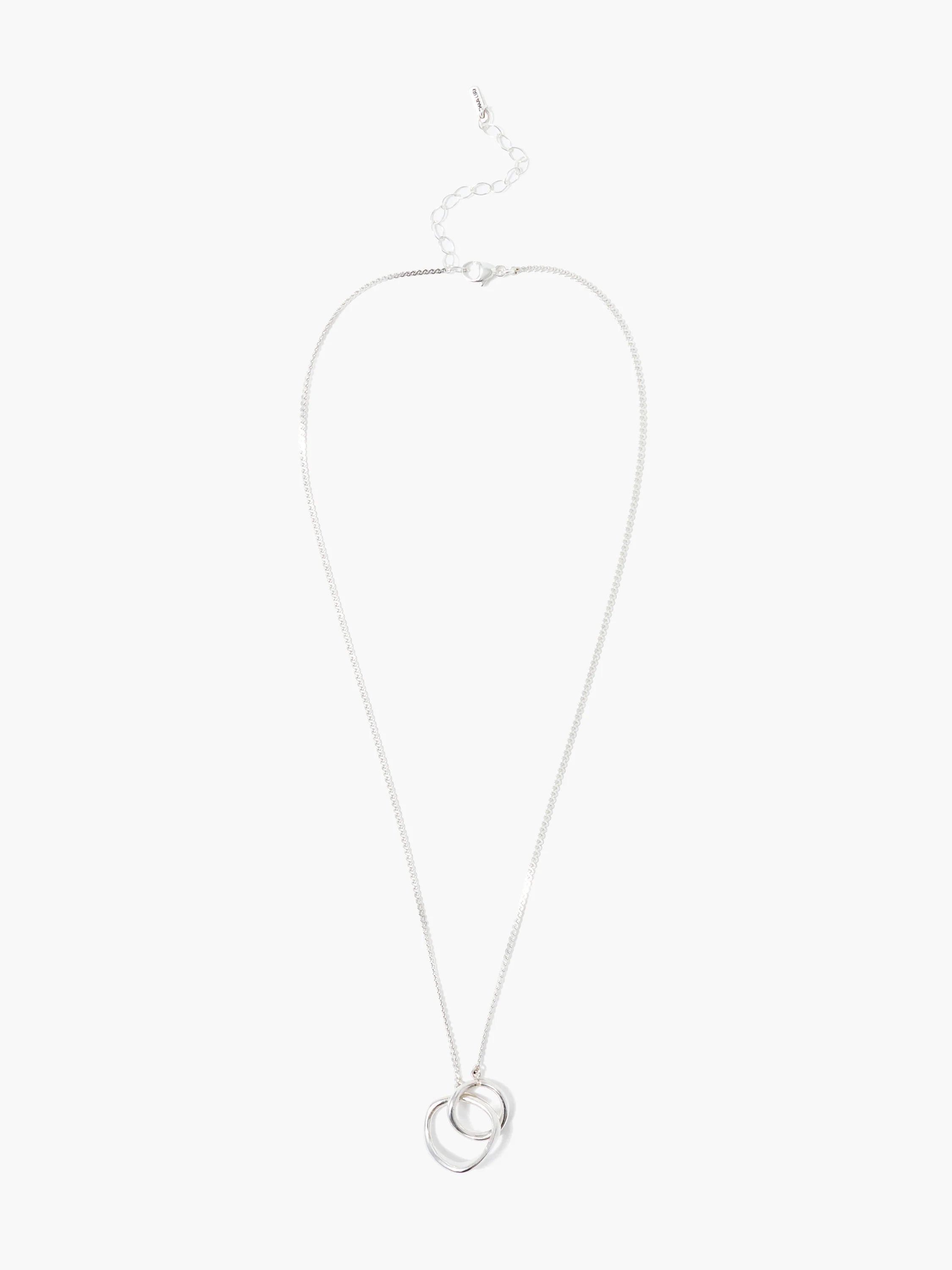 Silver necklace with two interlocking loops; one loop is organically shaped, the other is round.