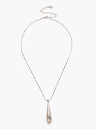 Silver snake chain necklace with teardrop-shaped abalone pendant; iridescent white, brown, and beige tones in pendant.