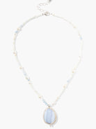 Blue lace agate pendant necklace; silver chain with white and light blue beads; teardrop-shaped blue pendant.