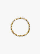 Gold-tone bracelet; circular, composed of small, uniform gold beads.