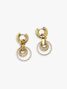 Gold dangle earrings. Each has a hoop top and three nested rings; the largest ring is thin, inner rings are thicker.