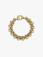 Gold bracelet: two parallel chains of oval links connected by smaller round links, lobster clasp.