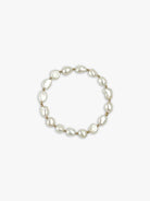 Off-white pearl bracelet with gold beads.