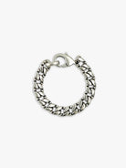 Silver curb chain bracelet with a clasp.