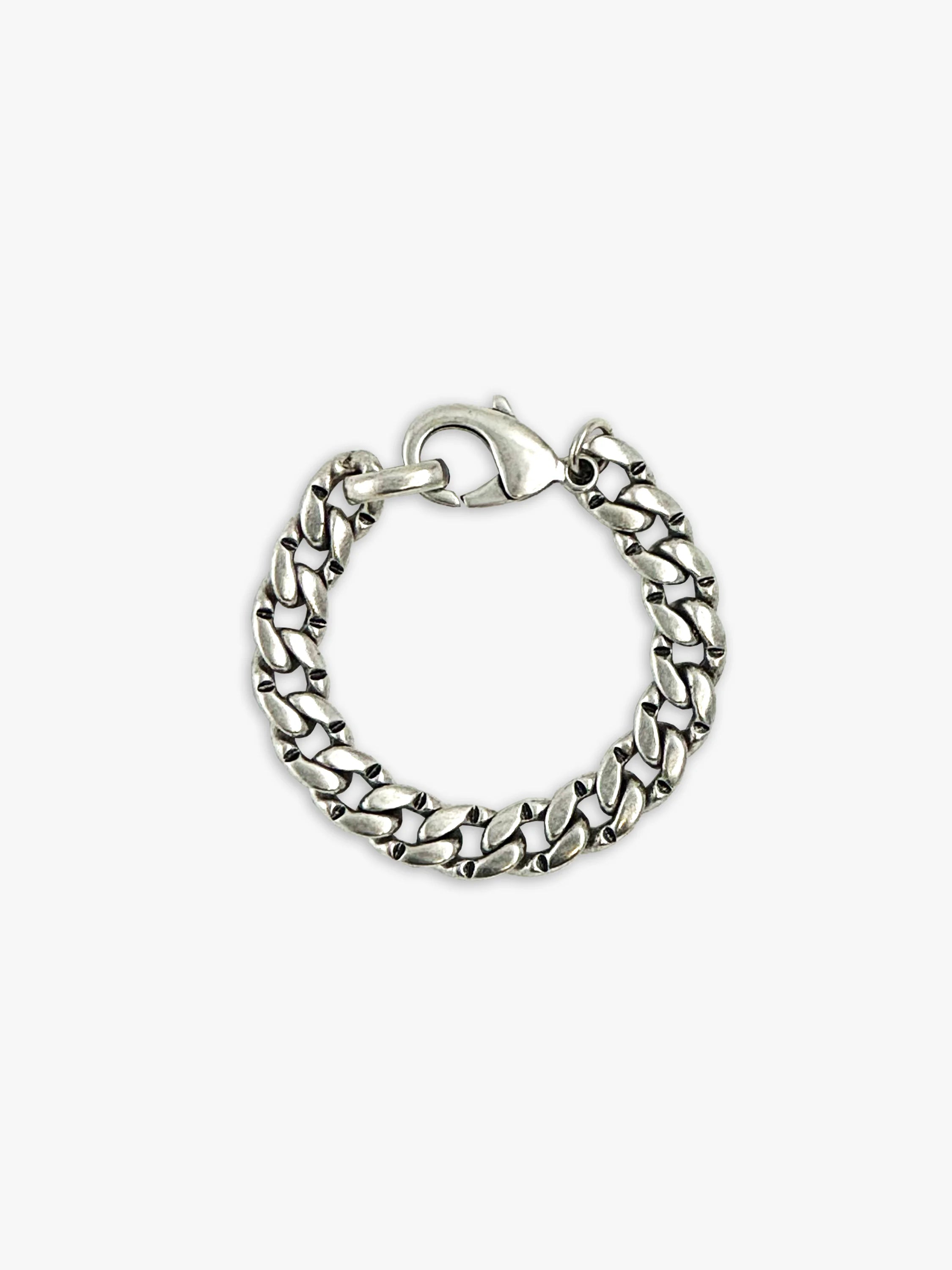 Silver curb chain bracelet with a clasp.