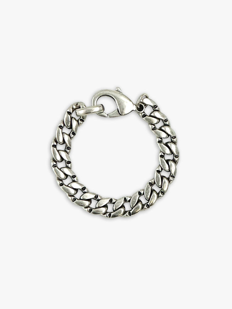 Silver curb chain bracelet with a lobster clasp.