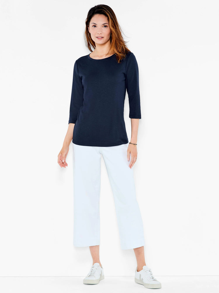 Navy 3/4 sleeve boat neck tee, shown on model. Smooth fabric, relaxed fit, hip-length.