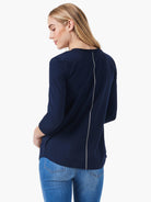 Navy blue long-sleeved top in a relaxed fit featuring a silver vertical stripe detail down the center back.