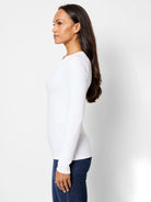 White ribbed, long-sleeved shirt; split neckline.