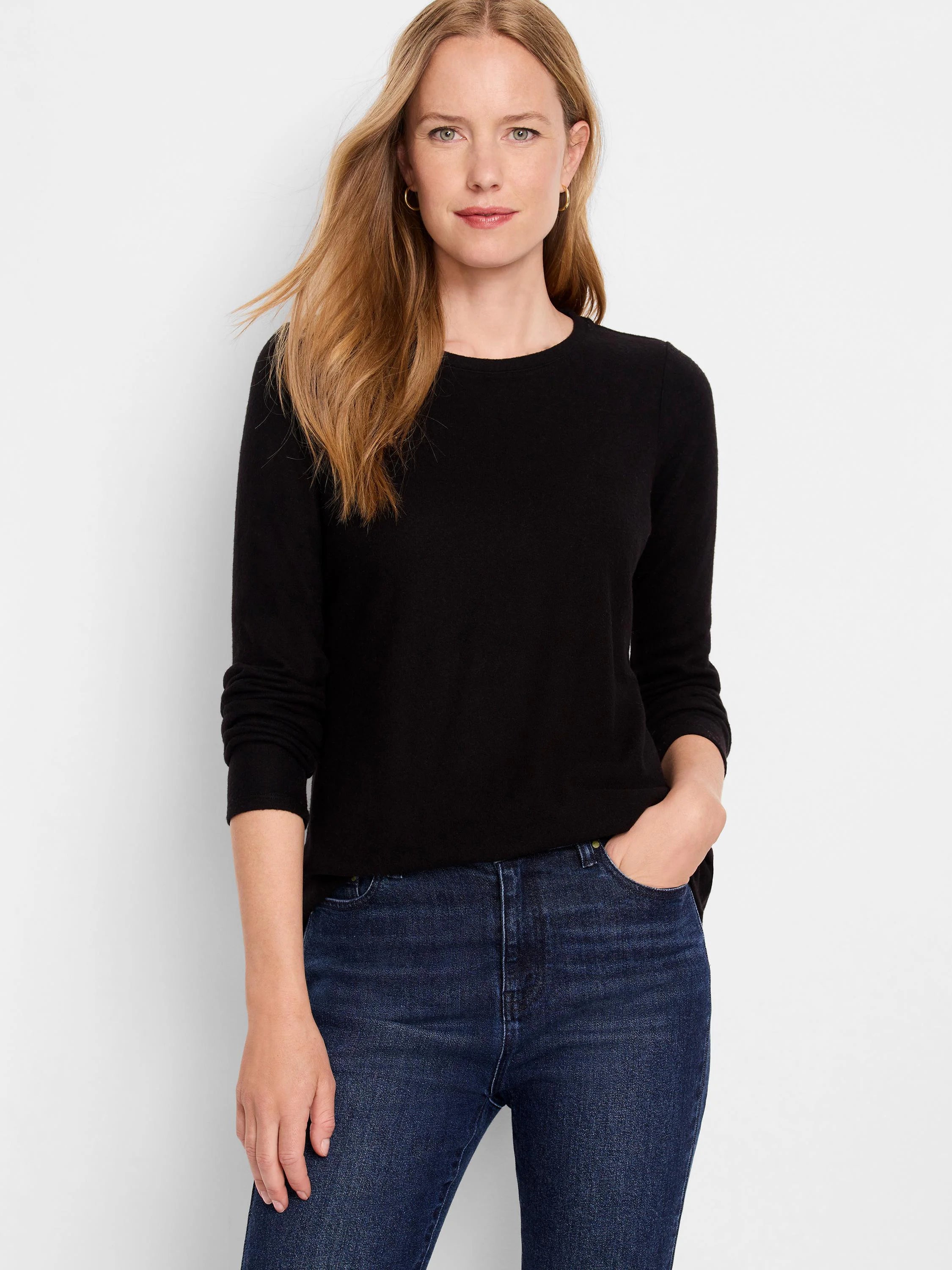 Black long-sleeve shirttail tee;  round neckline;  shown with dark wash jeans.