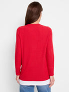 Red long-sleeve layered top.  The top layer is red, the bottom layer is white.