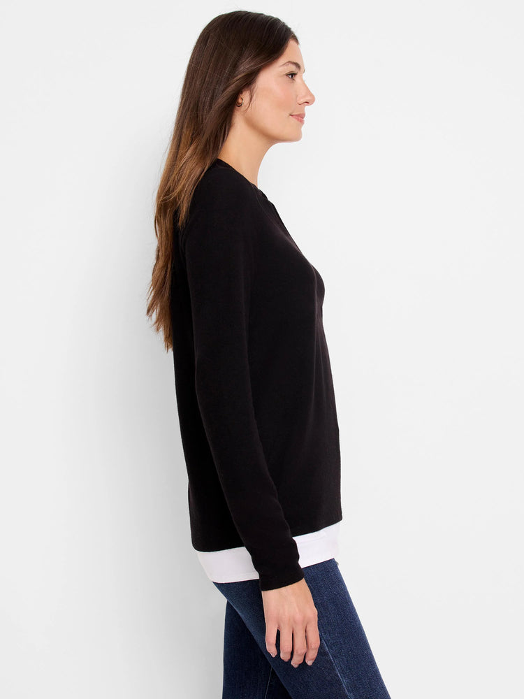 Black long-sleeved top, shown on model.  Slight raglan sleeve.