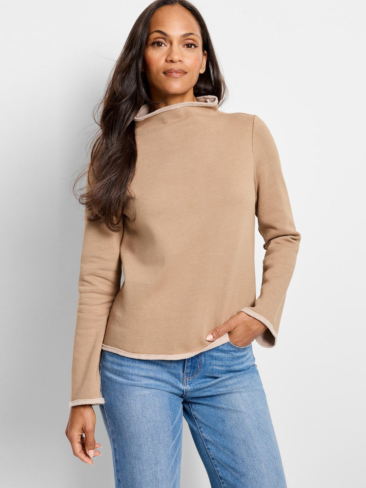 Beige long-sleeve top with lighter beige trim at neckline and cuffs.  High neckline.