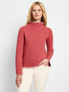 Reddish-pink long-sleeve mock neck top with darker pink trim.  Slightly curved hem.