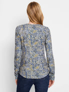 Long-sleeve scoop neck shirt;  blue, green, and white abstract sketched lines pattern.