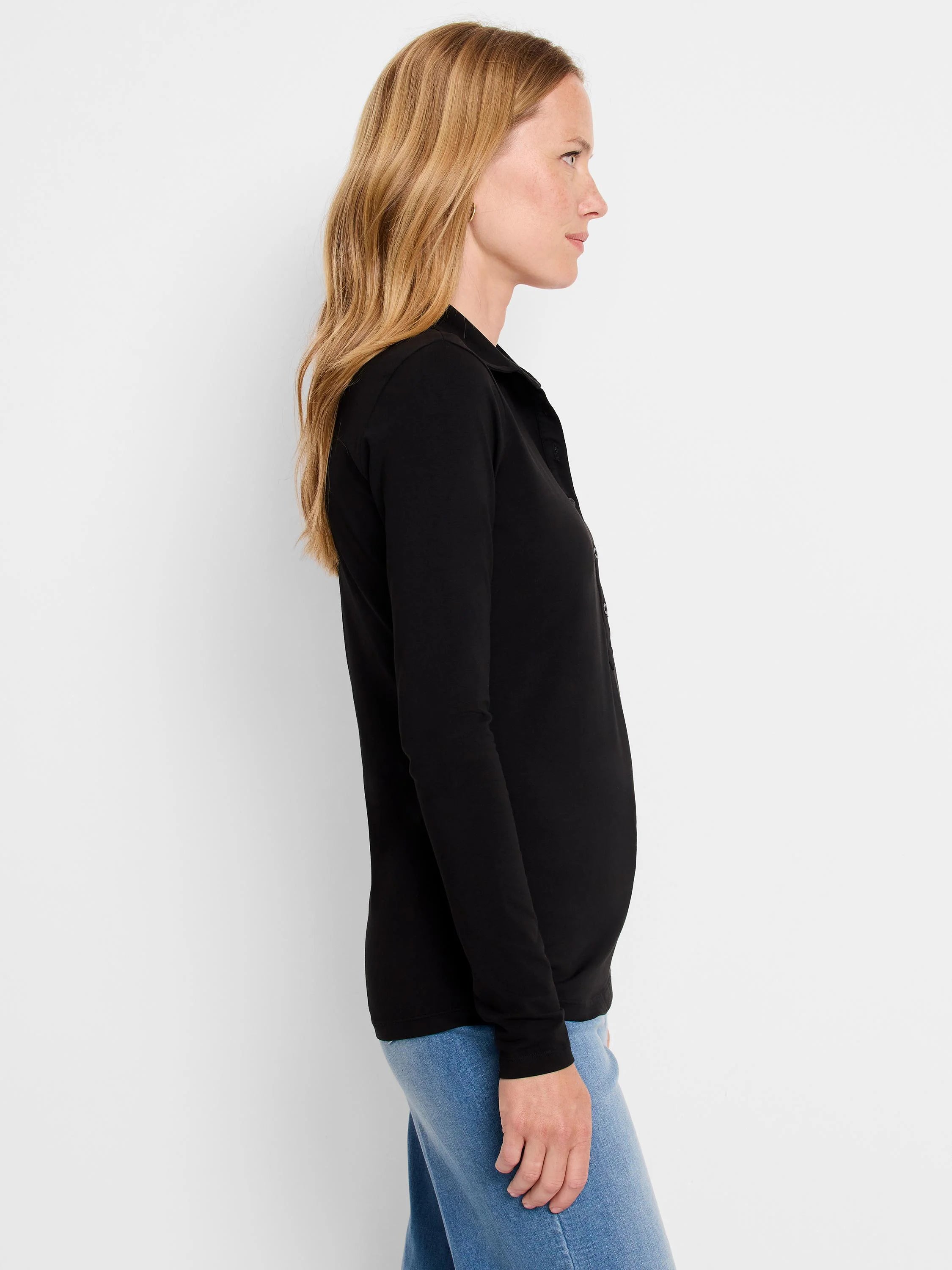 Black long-sleeve polo shirt, collared, shown in profile.