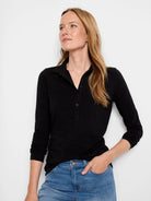 Black long-sleeve polo shirt with dark buttons.  Collared neckline.