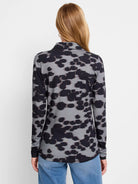 Gray long-sleeve polo shirt with a dark-gray/black abstract print.  Collared.
