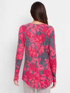 Long-sleeve shirt with pink and gray floral print.  Curved shirttail hem.