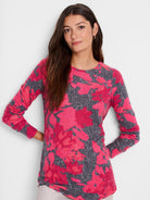 Long-sleeve shirt with pink and gray floral print.  Crew neck, shirttail hem.