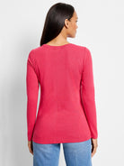 Pink long-sleeved shirt, crew neck,  back view.