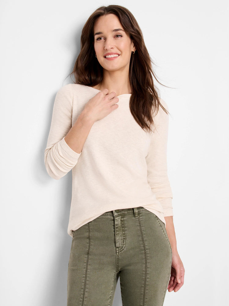 Off-white boatneck, long-sleeve shirt; model wears olive green pants.