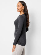 Dark gray, long-sleeved boat neck shirt.  Side profile view.