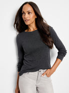 Dark gray, long-sleeved, crew-neck shirt.  Model also wears light gray pants.