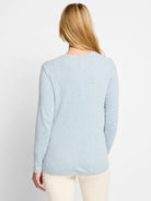 Light blue, long-sleeved boatneck shirt;  back view.