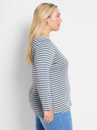 Gray and light gray horizontal striped long-sleeve shirt; boat neck.