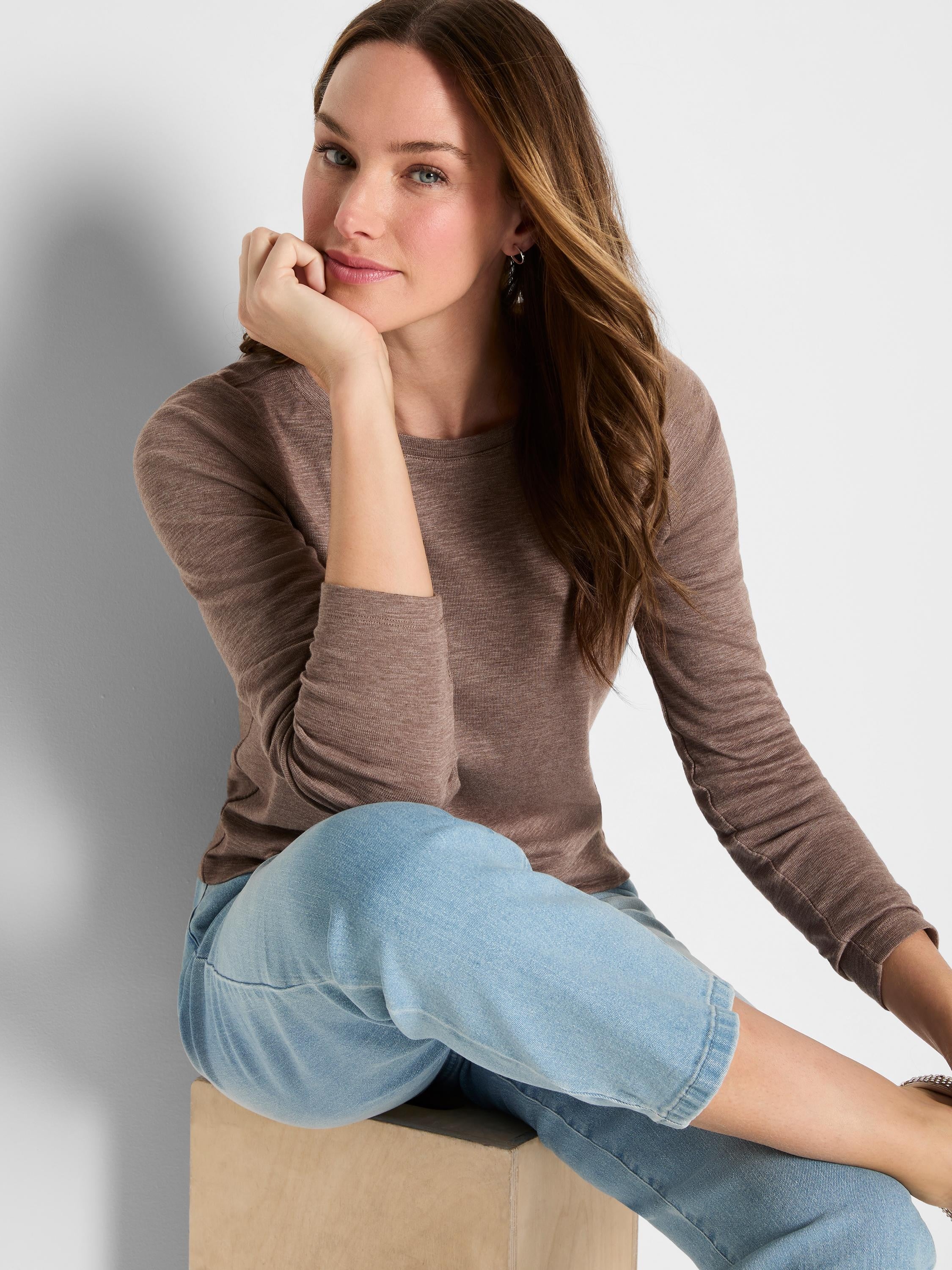 Heather brown long sleeve tee with a round neckline and subtle ribbed knit texture.
