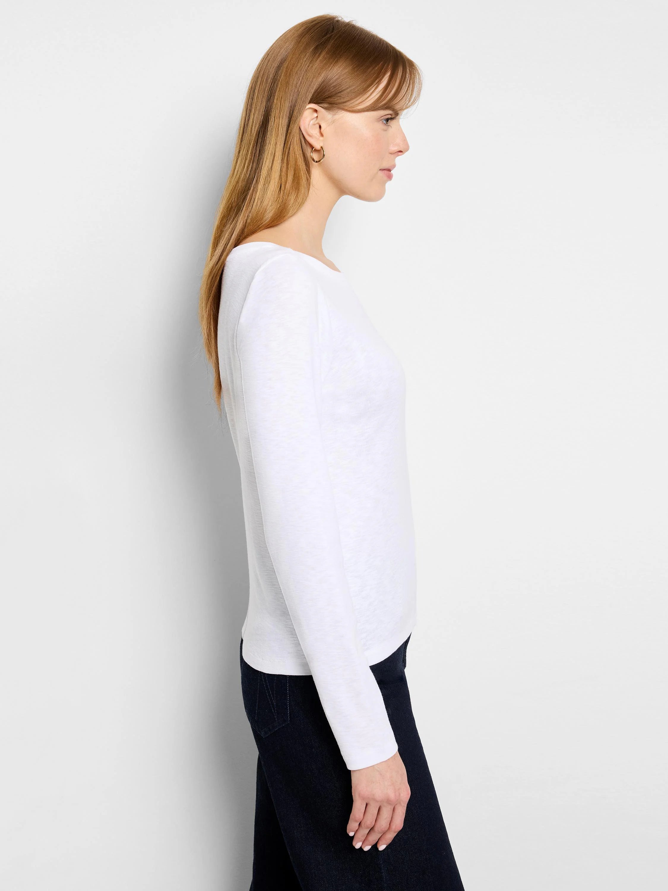White long-sleeve boat neck tee with a light texture, shown on a model in profile.