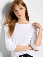 White long sleeve boat neck tee with a lightweight, slightly textured fabric.