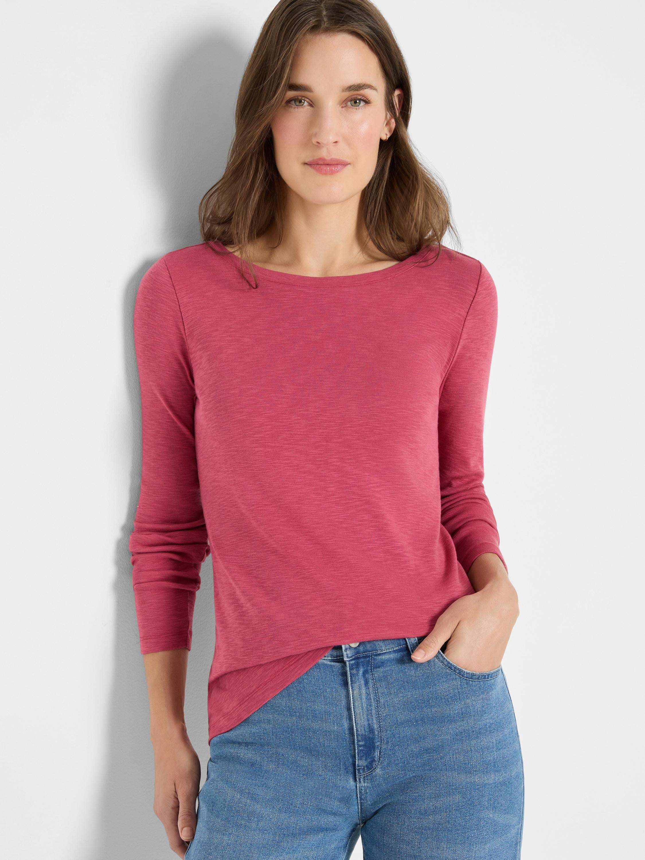 Pink long-sleeve boatneck shirt; textured fabric.