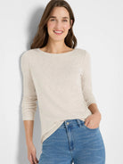 Beige long-sleeve boatneck shirt.  Light beige fabric with subtle texture.