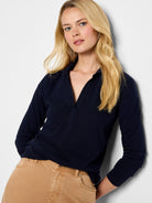 Dark blue long-sleeve polo top with a V-neck placket.