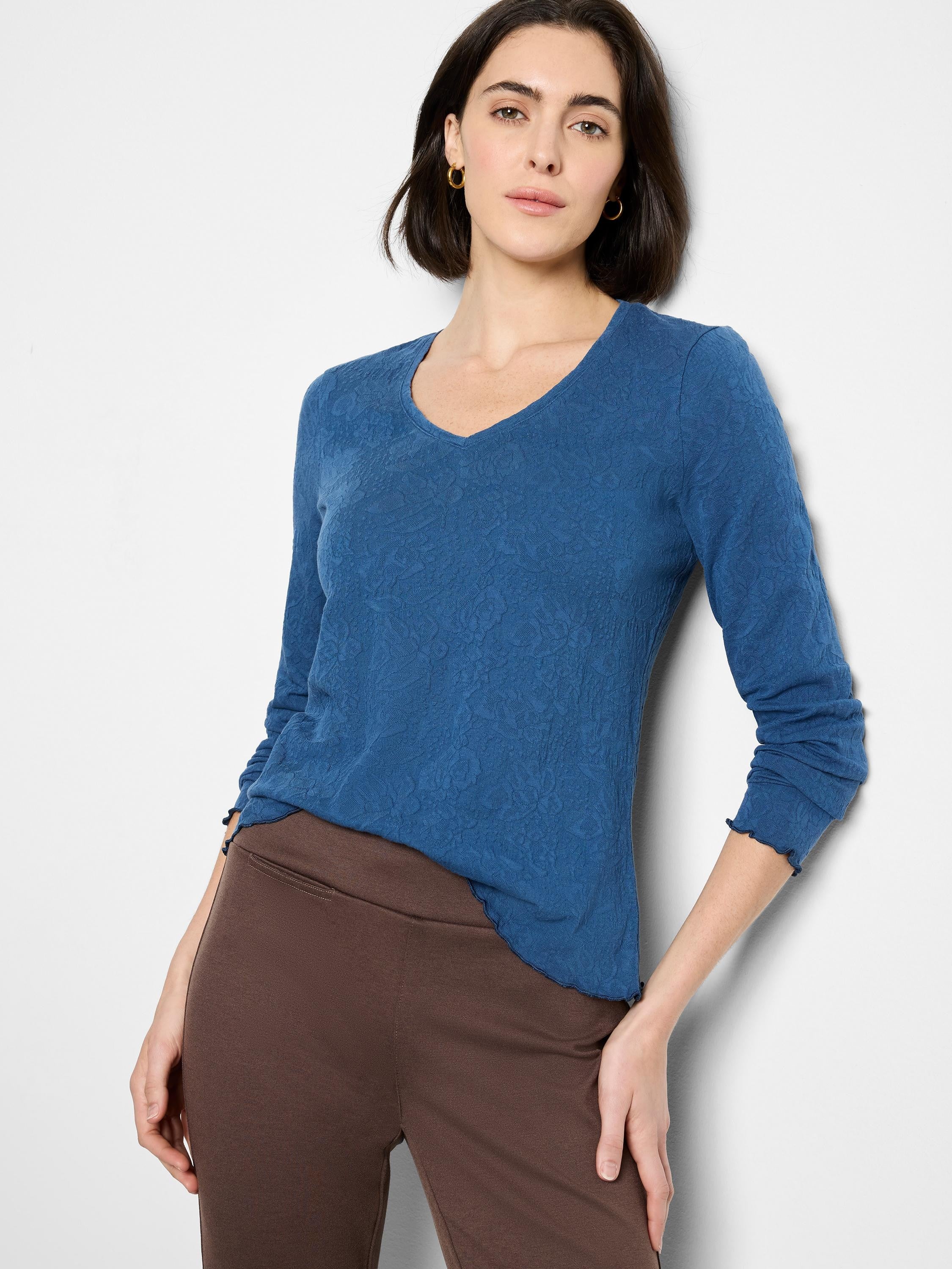 Blue, textured knit v-neck long-sleeve shirt with scalloped hem.