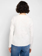 Off-white long-sleeved V-neck knit shirt with textured surface and scalloped back seam.  Rear view.