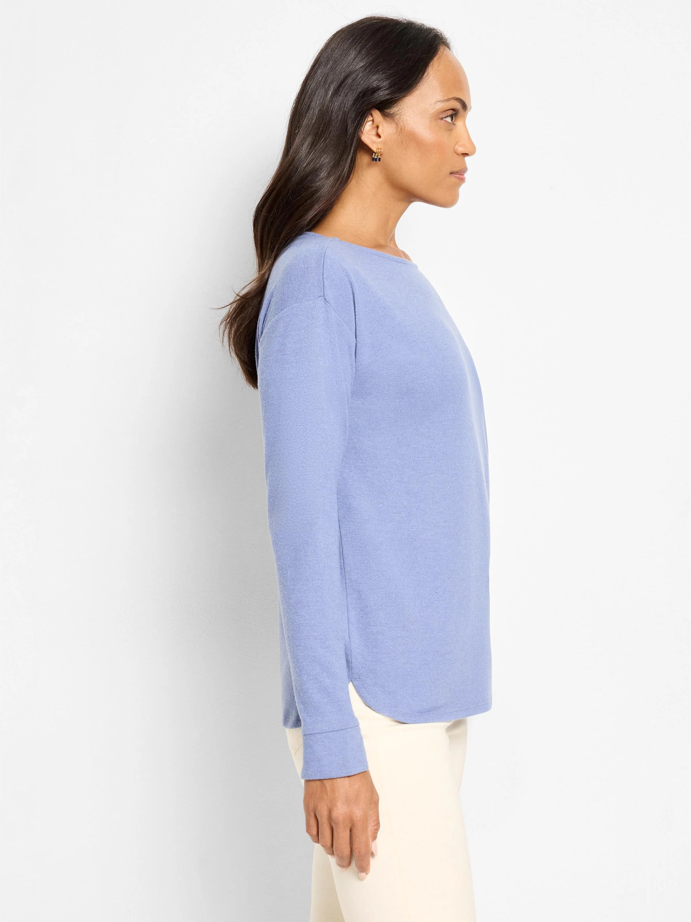 Periwinkle long-sleeve top. Relaxed knit with a wide neckline and curved hem.