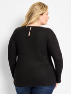 Black long-sleeve top. Round neck, keyhole back with small gold button.