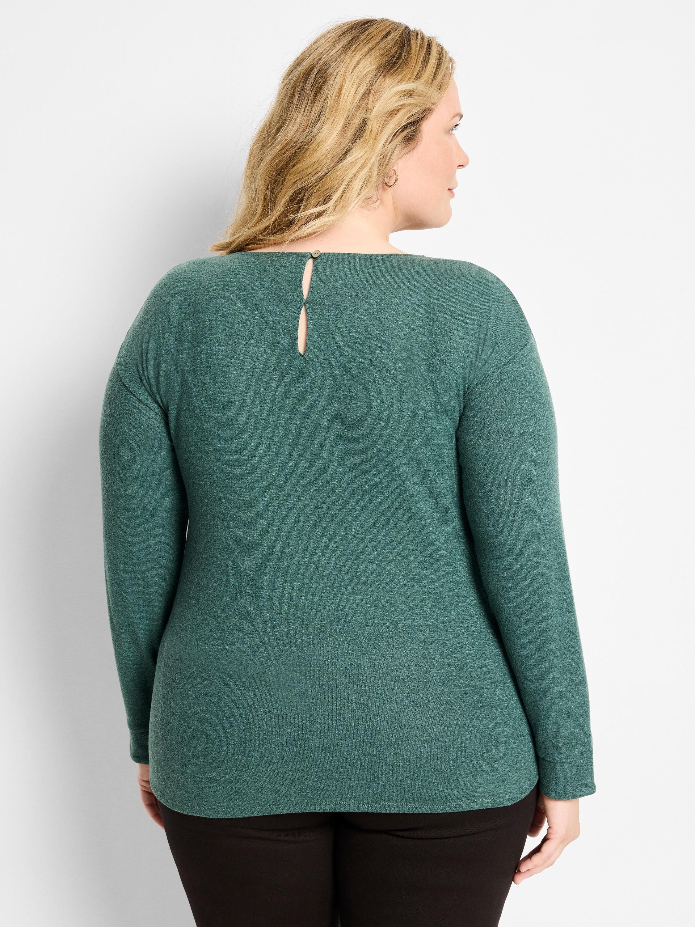 Back view of a woman wearing a dark teal heathered long-sleeved top with a back keyhole and button closure. Relaxed fit.