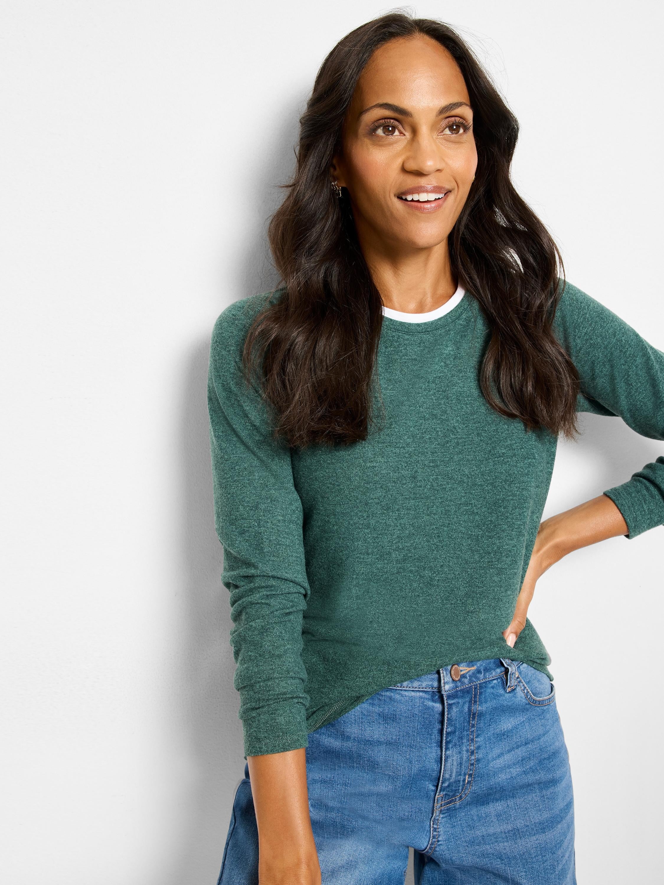 Green heathered long-sleeved top with white underlayer at crew neck.