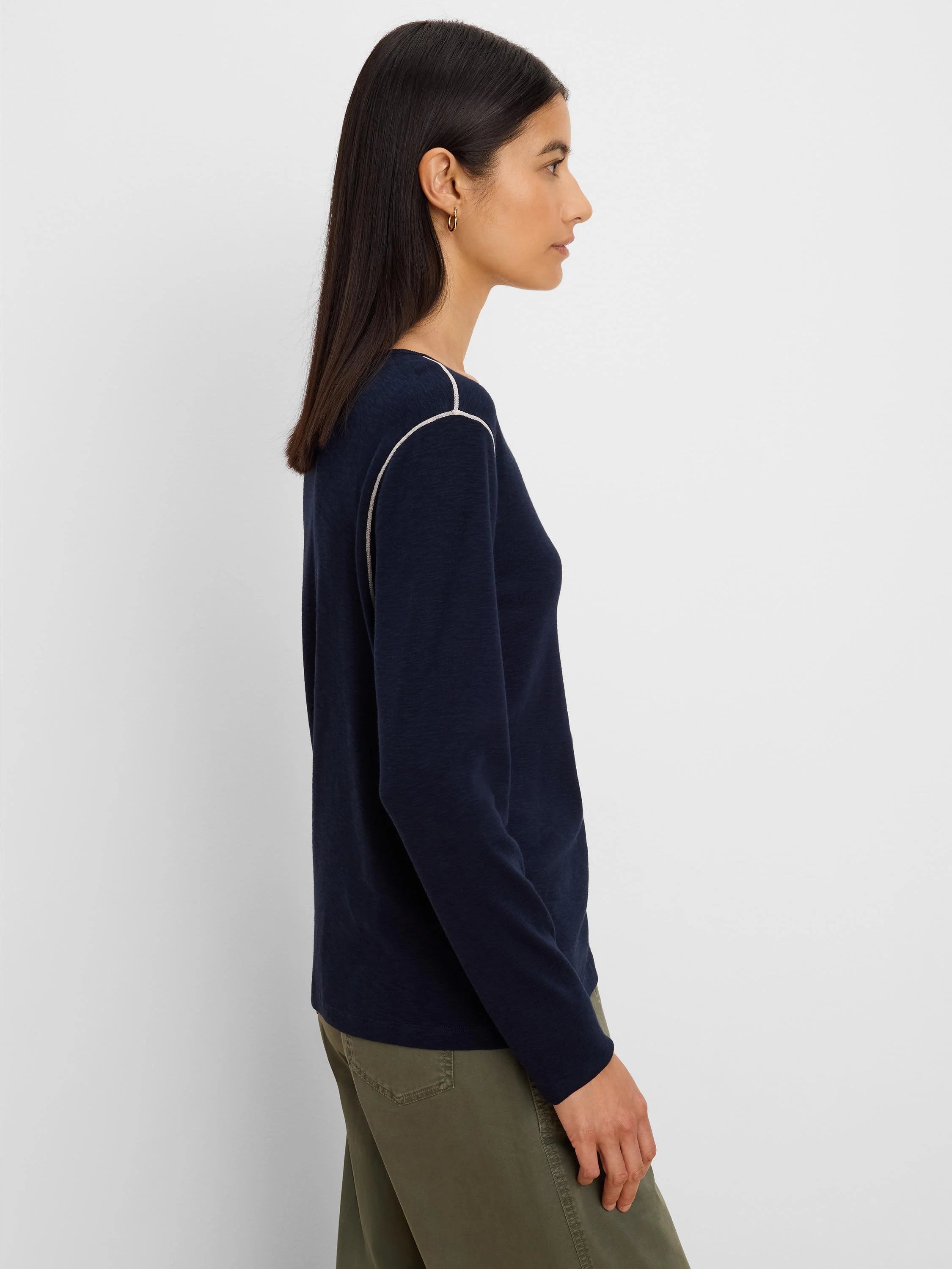 Navy blue long sleeve tee with light contrast stitching on raglan seams.