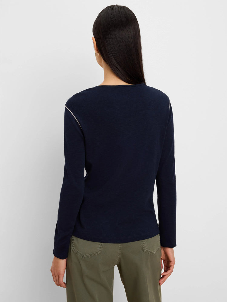 Dark navy long sleeve tee with subtle textured fabric and a thin white stripe along the shoulder and outer arm.