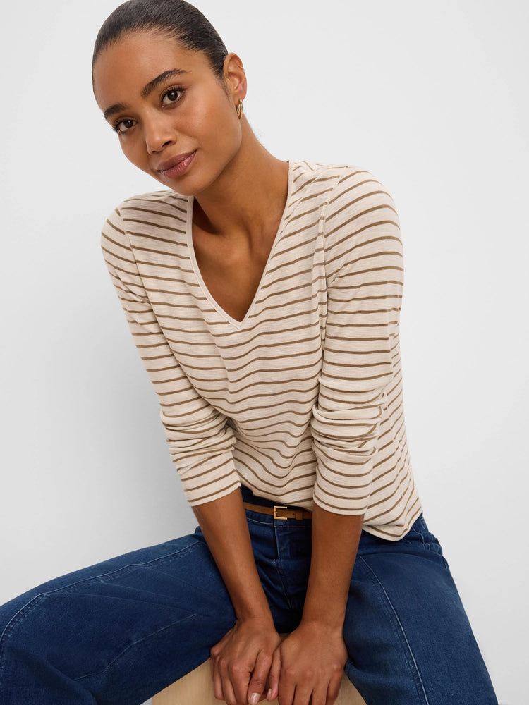 Cream v-neck long sleeve tee with narrow horizontal brown stripes.