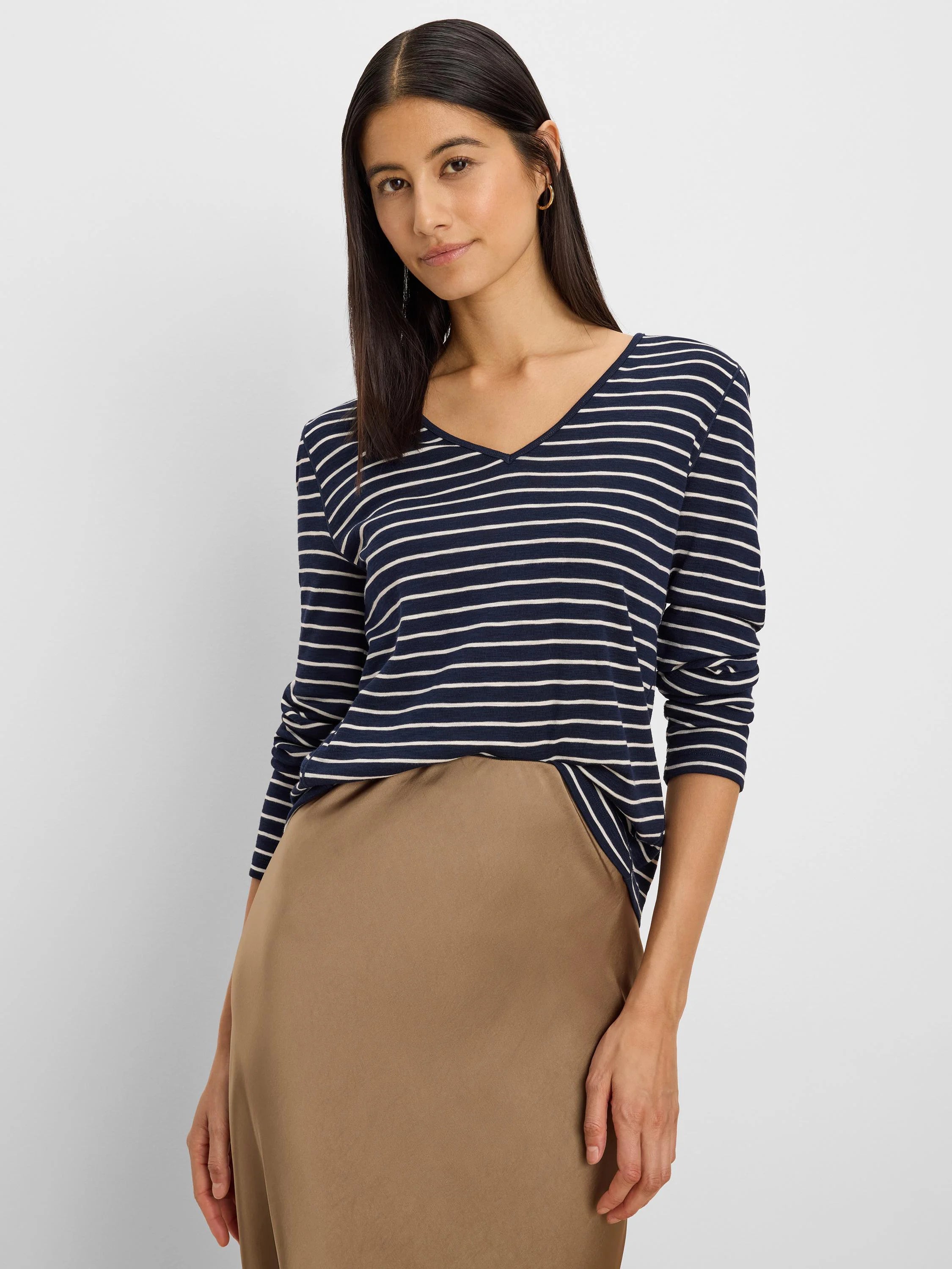 Navy and white striped long sleeve tee with a V-neck.