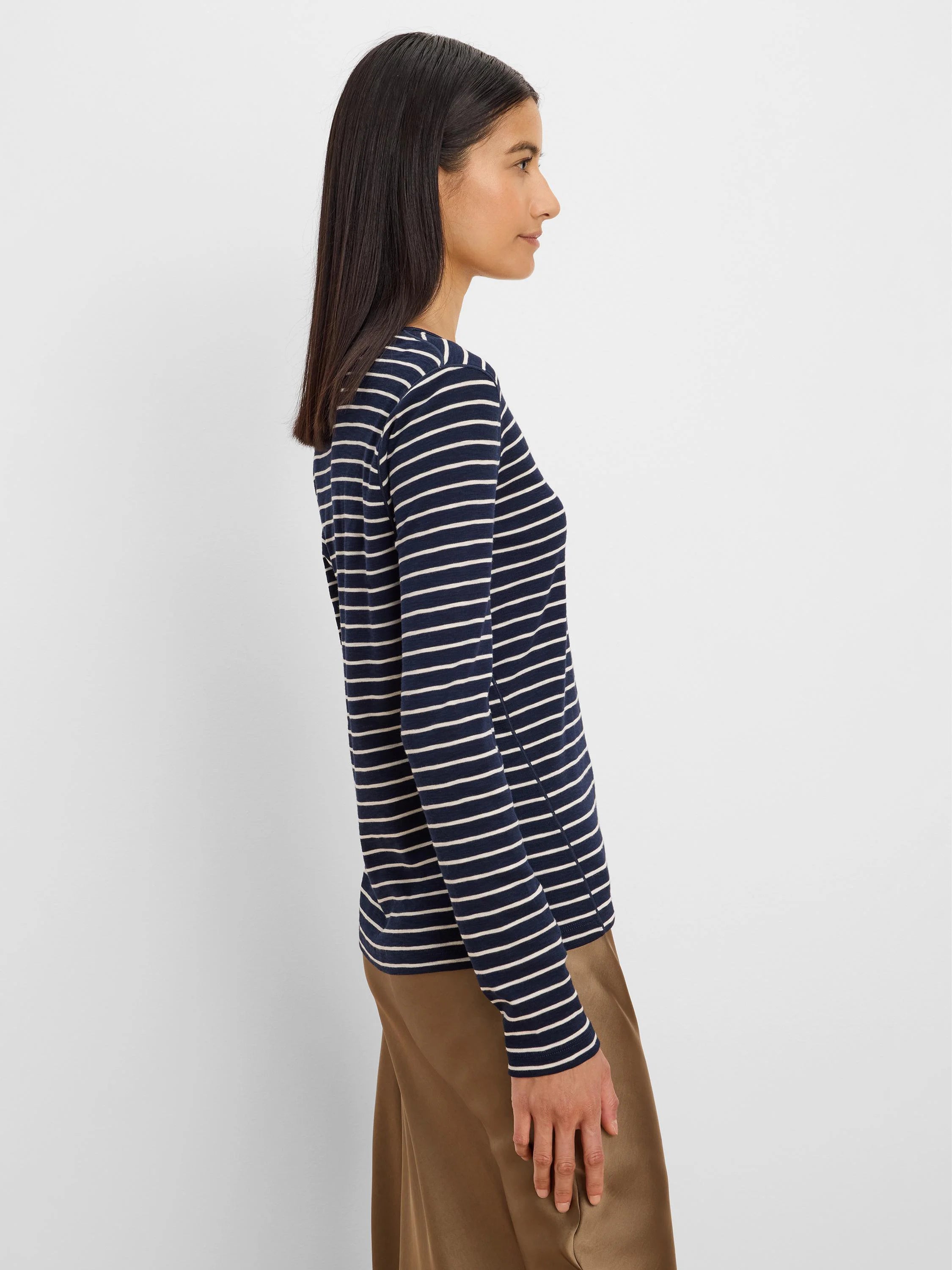 Navy blue long sleeve tee with thin horizontal white stripes.