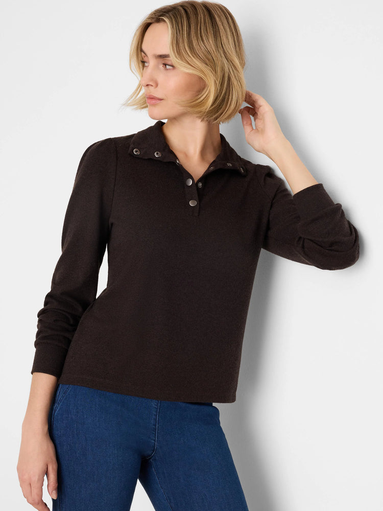 Dark brown collared tee with silver snap buttons, subtle puff sleeves.